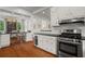 Modern kitchen featuring stainless steel appliances, white cabinets, and an open layout perfect for entertaining and everyday living at 1429 Noel Ne Dr, Brookhaven, GA 30319