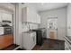 Functional laundry room with modern washer and dryer and ample cabinet space at 1429 Noel Ne Dr, Brookhaven, GA 30319