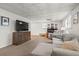Finished basement living room with patterned ceilings, large sectional sofa and big screen TV at 1429 Noel Ne Dr, Brookhaven, GA 30319