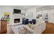 Bright living room boasts a fireplace, hardwood floors and access to backyard at 1429 Noel Ne Dr, Brookhaven, GA 30319