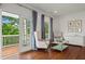 This sitting area off the main bedroom has an outdoor balcony with French doors and great light at 1429 Noel Ne Dr, Brookhaven, GA 30319