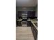 Modern kitchen with stainless steel appliances and granite countertops at 1794 Fielding Way, Hampton, GA 30228