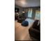 Inviting living room with hardwood floors, natural light, and cozy furnishings at 1794 Fielding Way, Hampton, GA 30228