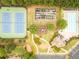 Aerial view of community amenities including tennis courts, basketball court, pool, playground, and common green space at 2059 Ivey Chase Dr, Dacula, GA 30019