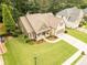 Aerial back view of a home surrounded by lush trees, showcasing the spacious backyard at 2059 Ivey Chase Dr, Dacula, GA 30019