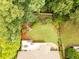 Aerial of the backyard showing a lush lawn, garden, and outdoor living space at 2059 Ivey Chase Dr, Dacula, GA 30019
