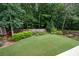 Well maintained backyard showing lawn, privacy fence, and storage shed at 2059 Ivey Chase Dr, Dacula, GA 30019