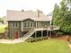 A well manicured backyard that features a deck and patio for outdoor living at 2059 Ivey Chase Dr, Dacula, GA 30019