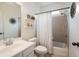 Well-lit bathroom with a shower-tub combo, vanity with sink, and decorative shelving at 2059 Ivey Chase Dr, Dacula, GA 30019
