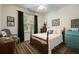 Cozy bedroom featuring a wood-frame bed, a neutral palette, and an abundance of natural light at 2059 Ivey Chase Dr, Dacula, GA 30019