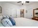 Bright bedroom featuring a wood-frame bed, and a neutral palette at 2059 Ivey Chase Dr, Dacula, GA 30019