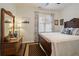 Bright bedroom featuring a wood-frame bed, and a neutral palette at 2059 Ivey Chase Dr, Dacula, GA 30019