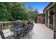 Backyard deck area with grill and dining table, perfect for outdoor living at 2059 Ivey Chase Dr, Dacula, GA 30019