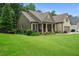 Well-maintained home with a lush green lawn and established landscaping at 2059 Ivey Chase Dr, Dacula, GA 30019