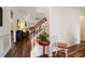 Bright foyer with hardwood floors, a staircase, and elegant wainscoting at 2059 Ivey Chase Dr, Dacula, GA 30019