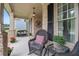 Cozy front porch featuring brick columns and comfortable seating at 2059 Ivey Chase Dr, Dacula, GA 30019