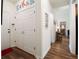 Inviting entryway featuring a coat closet, hardwood floors, and access to other rooms at 2059 Ivey Chase Dr, Dacula, GA 30019