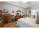 Large main bedroom with tray ceiling, wood floors, and an attached bathroom and office at 2059 Ivey Chase Dr, Dacula, GA 30019