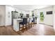Bright and modern kitchen featuring white cabinets, stainless steel appliances, and a functional breakfast bar at 4430 Lamar Dr, Douglasville, GA 30134