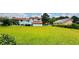 Expansive backyard with a well-kept lawn and view of the home's rear exterior at 472 Opel St, Riverdale, GA 30274