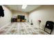 Spacious basement with decorative tile flooring, natural light, and furniture at 472 Opel St, Riverdale, GA 30274