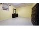 This bedroom features tile flooring and a dark wood dresser with a mirror at 472 Opel St, Riverdale, GA 30274