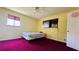Bedroom with yellow walls and pink carpet at 472 Opel St, Riverdale, GA 30274