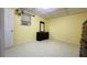 Neutral bedroom features tile flooring, dresser, and ample space at 472 Opel St, Riverdale, GA 30274