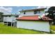Exterior rear view shows the home's siding, roof, deck, and access to the backyard at 472 Opel St, Riverdale, GA 30274