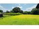 View of the spacious yard and lush surroundings, showcasing the property's natural beauty at 472 Opel St, Riverdale, GA 30274