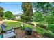 Backyard with a seating area, mature landscaping, and a view of the home at 4720 Cliffside Ct, Marietta, GA 30067