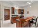 Stylish bar area with wooden cabinetry, granite countertops, and mirrored backsplash at 4720 Cliffside Ct, Marietta, GA 30067