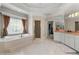 Bright bathroom features a soaking tub, and a separate shower, and access to the walk-in closet at 4720 Cliffside Ct, Marietta, GA 30067