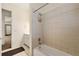 Bright bathroom featuring white tile shower, a bathtub, and an access to a hallway that brings in natural light at 4720 Cliffside Ct, Marietta, GA 30067