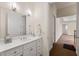 Bright bathroom featuring a white vanity with drawers and a large mirror, providing ample storage and light at 4720 Cliffside Ct, Marietta, GA 30067
