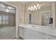 Bright bathroom featuring a large vanity with a white countertop, ample cabinet space, and a large mirror at 4720 Cliffside Ct, Marietta, GA 30067