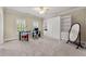 Bedroom with a work area with glass desk, window shutters, and closet with built-in shelving at 4720 Cliffside Ct, Marietta, GA 30067