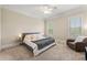 Cozy bedroom with a comfortable bed, sitting chair, carpet, and natural light from the window at 4720 Cliffside Ct, Marietta, GA 30067