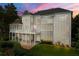 Exterior of the home at dusk featuring a spacious balcony and well-manicured lawn at 4720 Cliffside Ct, Marietta, GA 30067