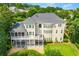 Rear exterior showcasing the home with a spacious balcony and well-manicured lawn at 4720 Cliffside Ct, Marietta, GA 30067