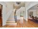 Inviting foyer boasts a grand staircase with detailed iron railings and beautiful hardwood floors at 4720 Cliffside Ct, Marietta, GA 30067