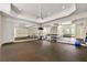 Home gym featuring mirrors, rubber flooring, and exercise equipment at 4720 Cliffside Ct, Marietta, GA 30067