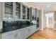Elegant butler's pantry with marble backsplash, modern cabinetry, and built-in stainless steel appliances at 4720 Cliffside Ct, Marietta, GA 30067