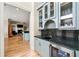 Kitchen wet bar area with wine storage, sink and granite countertops at 4720 Cliffside Ct, Marietta, GA 30067
