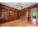 Elegant home library with custom built-in bookshelves and rich wood paneling at 4720 Cliffside Ct, Marietta, GA 30067