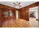 Elegant home library with custom built-in bookshelves and rich wood paneling, leading to the dining room at 4720 Cliffside Ct, Marietta, GA 30067