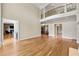 Spacious living area with hardwood floors, fireplace, and open access to multiple rooms at 4720 Cliffside Ct, Marietta, GA 30067