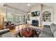 Living room with hardwood floors, fireplace, built-in shelving and large windows at 4720 Cliffside Ct, Marietta, GA 30067