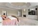 Spacious main bedroom features a fireplace, tray ceiling, and built-in entertainment center at 4720 Cliffside Ct, Marietta, GA 30067