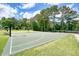 Community outdoor basketball court features well-maintained surface, hoops, and benches for recreation and fun at 921 Laurel Crest Dr, Woodstock, GA 30189